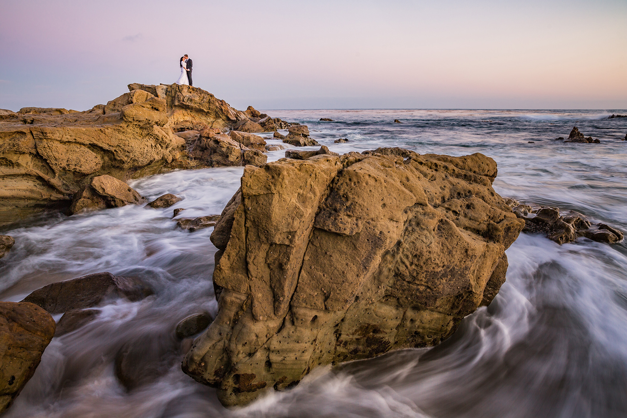 Photographer using Lightroom presets to edit a portrait