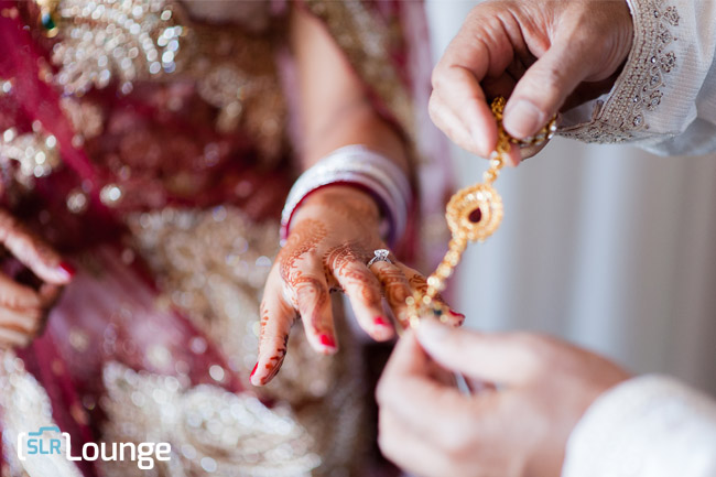 Wedding ring photograph demonstrating precise single point autofocus on detail shot at wide aperture during wedding photography