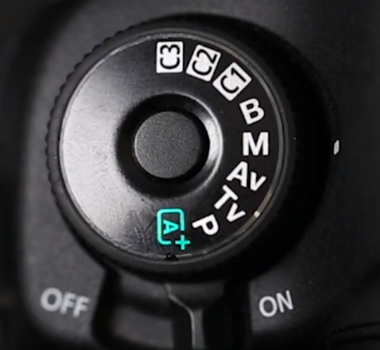 Canon DSLR mode dial turned to M for Manual mode, used for HDR photography and flash work